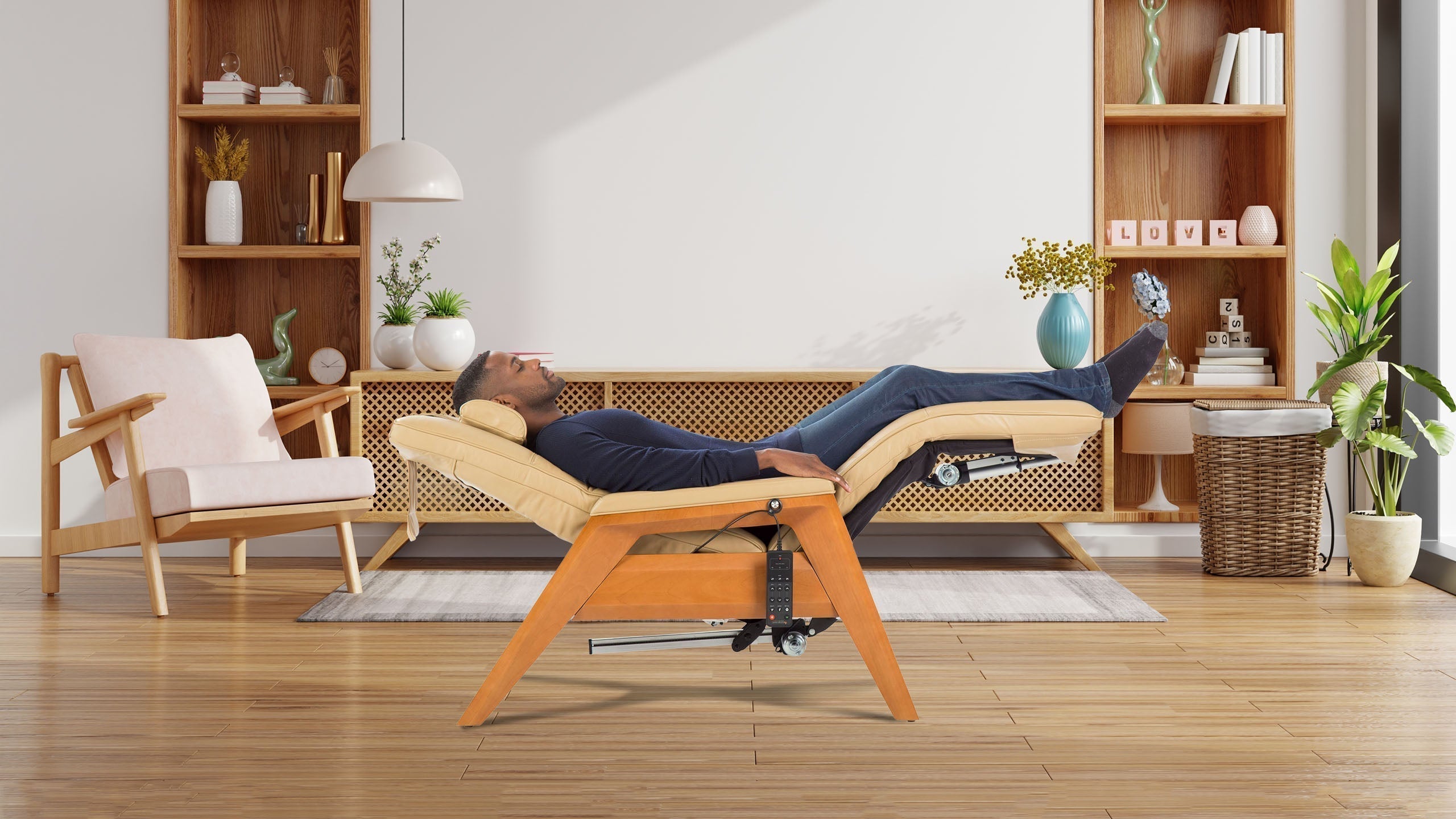 Man reclining with legs elevated in a yellow leather zero gravity chair with wooden legs in a warm Scandinavian living room