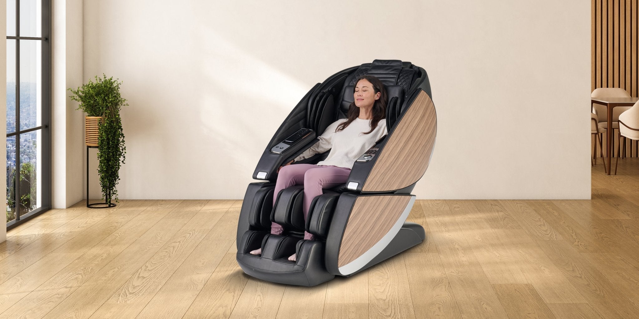 Woman relaxing with eyes closed in black full body massage chair with wood panel accents in modern home