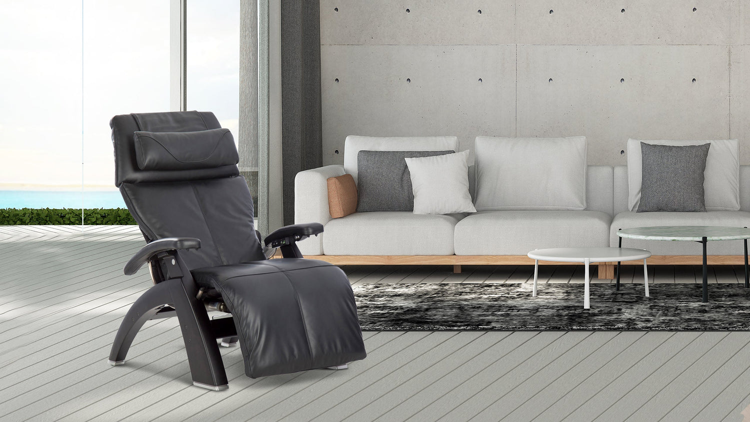 Dark gray leather zero gravity recliner with matte black curved wood frame and headrest cushion