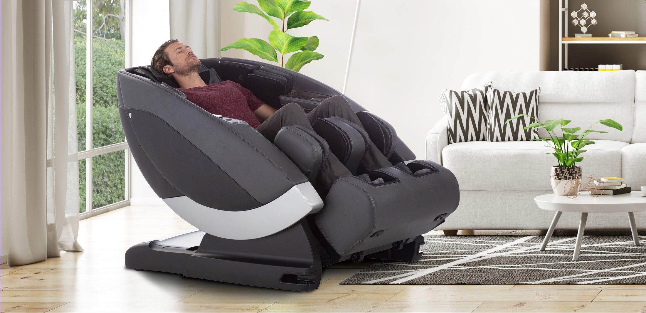 Person using a Super Novo massage chair in a modern living room.