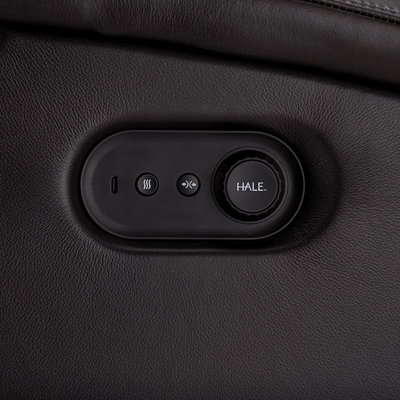 Control panel with buttons on a black leather surface