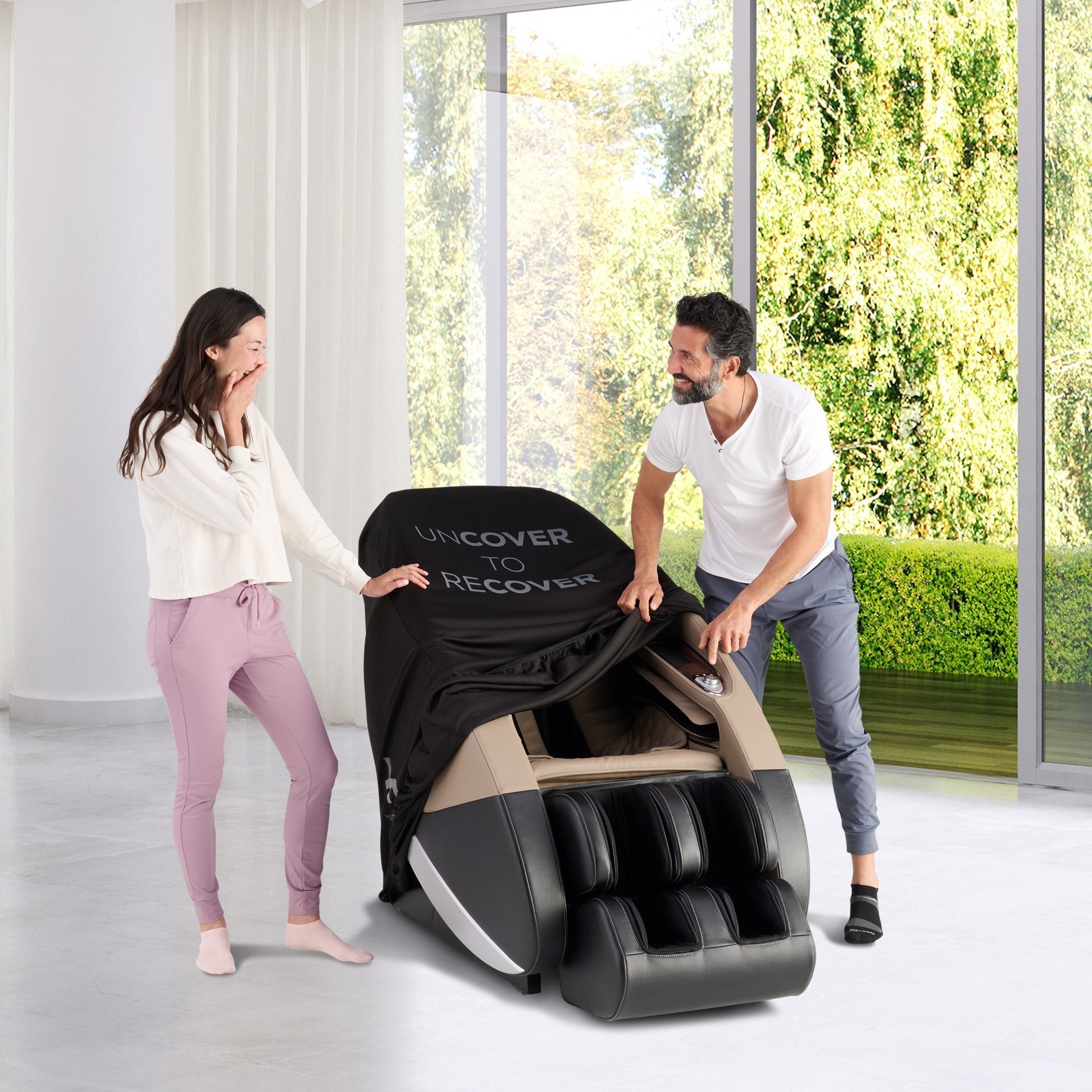 Black massage chair cover protecting luxury recliner in modern bright room with large windows