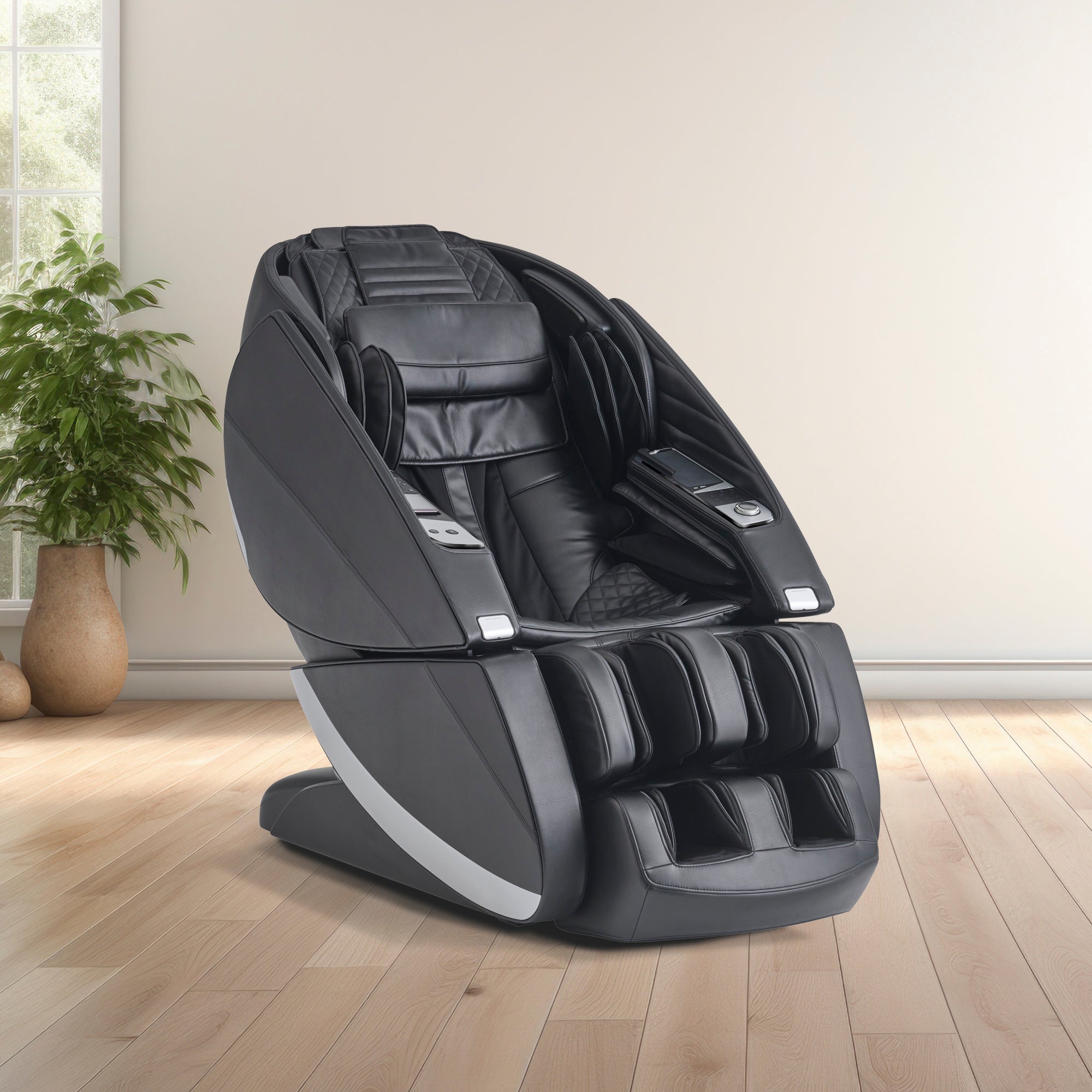 Super Novo X Massage Chair in black leather with teardrop doors, positioned on hardwood floor against white wall with plant decor