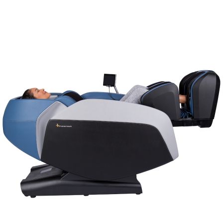 Certus massage chair in Sky, reclined with woman in chair