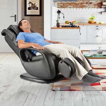 WholeBody® 7.1 Massage Chair  in Black upholstery - Man in chair in a room setting