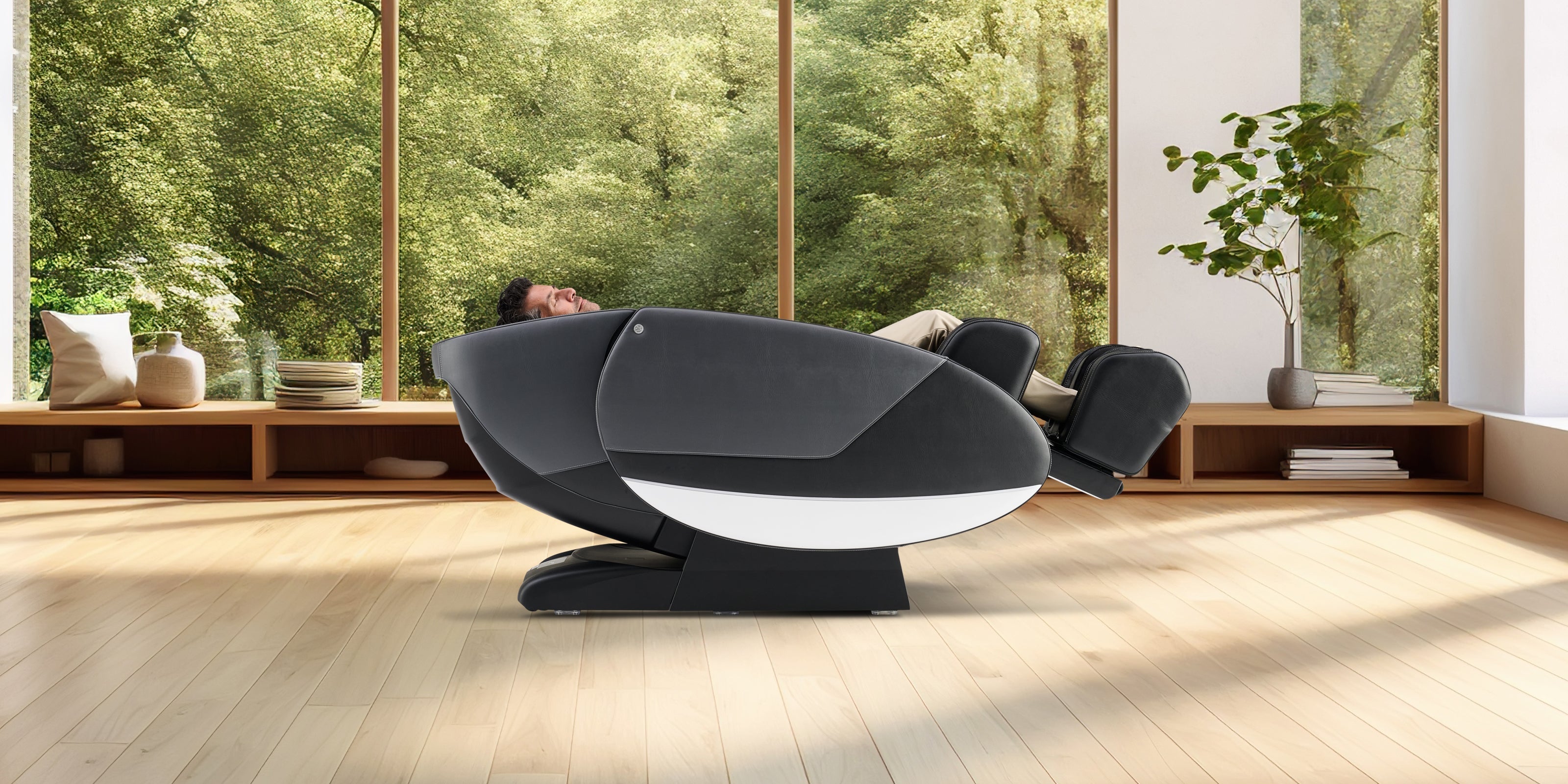 Man sitting in a Super Novo 2.0 massage chair in zero gravity position at his chiropractor's office