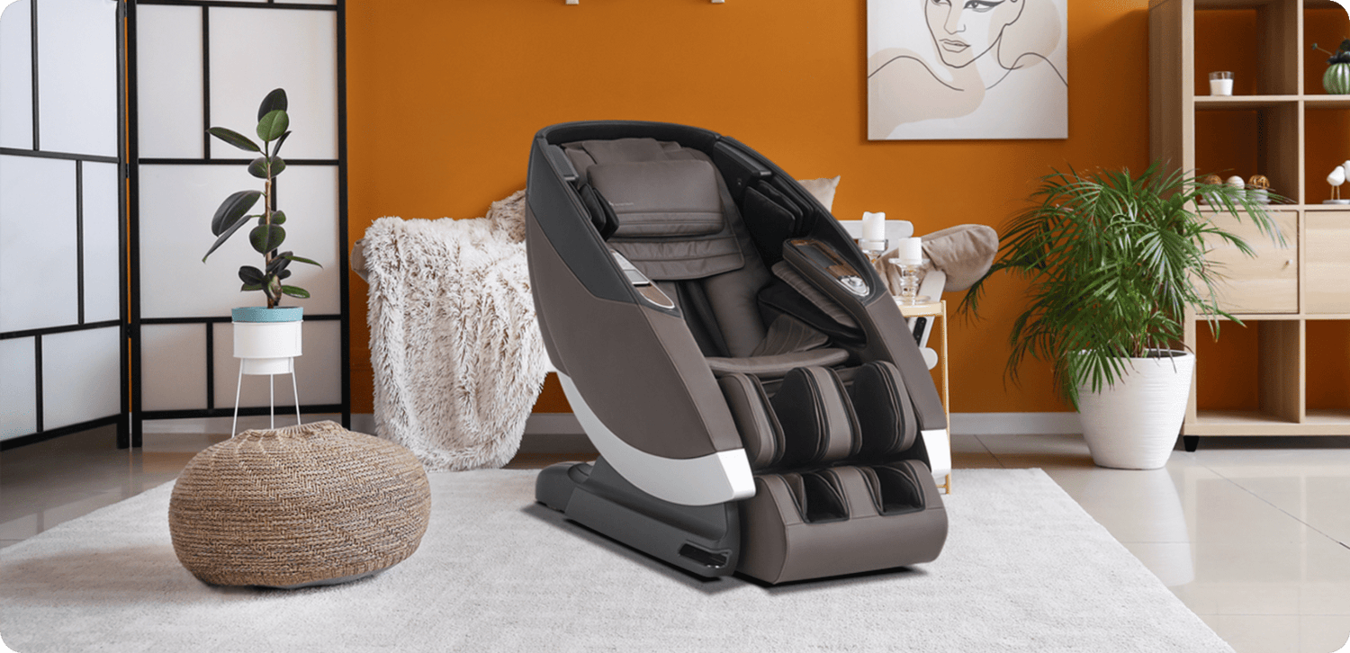 Brown and black full-body zero gravity massage chair with calf massager and silver accent in a warm bohemian living room