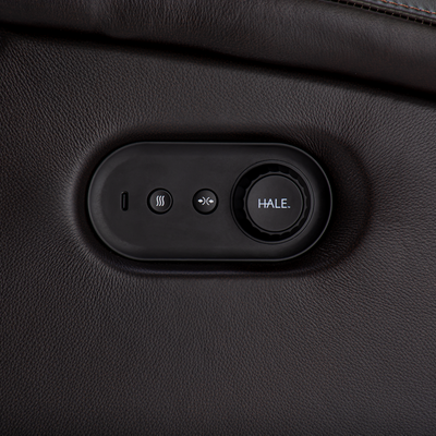 Control panel with buttons on a black leather surface