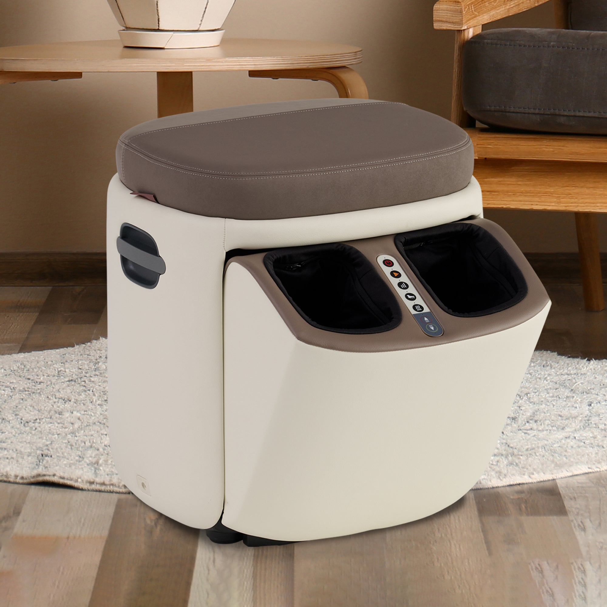 Reveal Ottoman Massager in cream and gray with built-in foot massage compartment on wooden floor near furniture