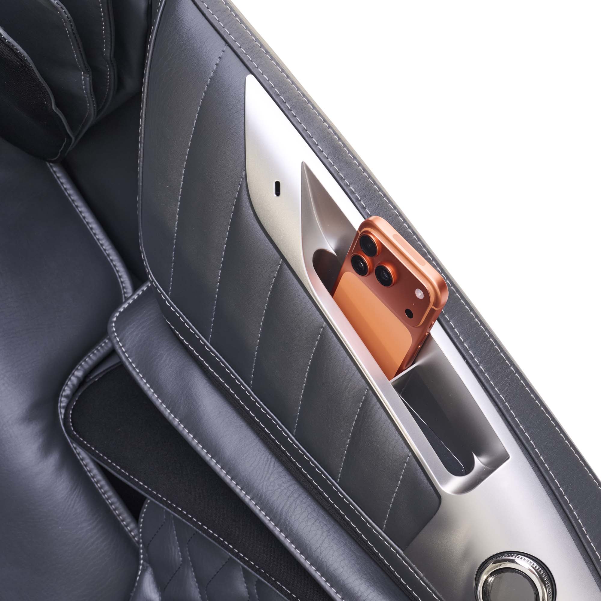 Phone in a massage chair pocket organizer with gray interior background