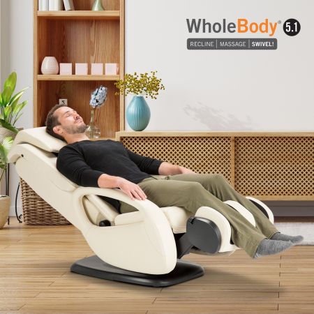 Bone-colored WholeBody® 5.1 Massage Chair in room setting with man reclined