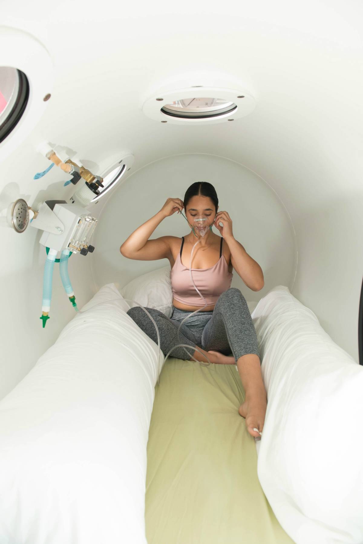 Woman in a hyperbaric chamber, about to get treatment